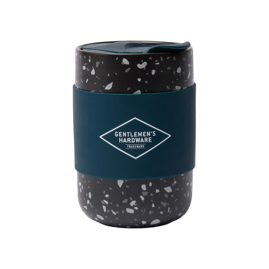 Ceramic coffee mug 400 ml / 13.5 fl oz in speckled black design with a blue silicone sleeve for grip and insulation