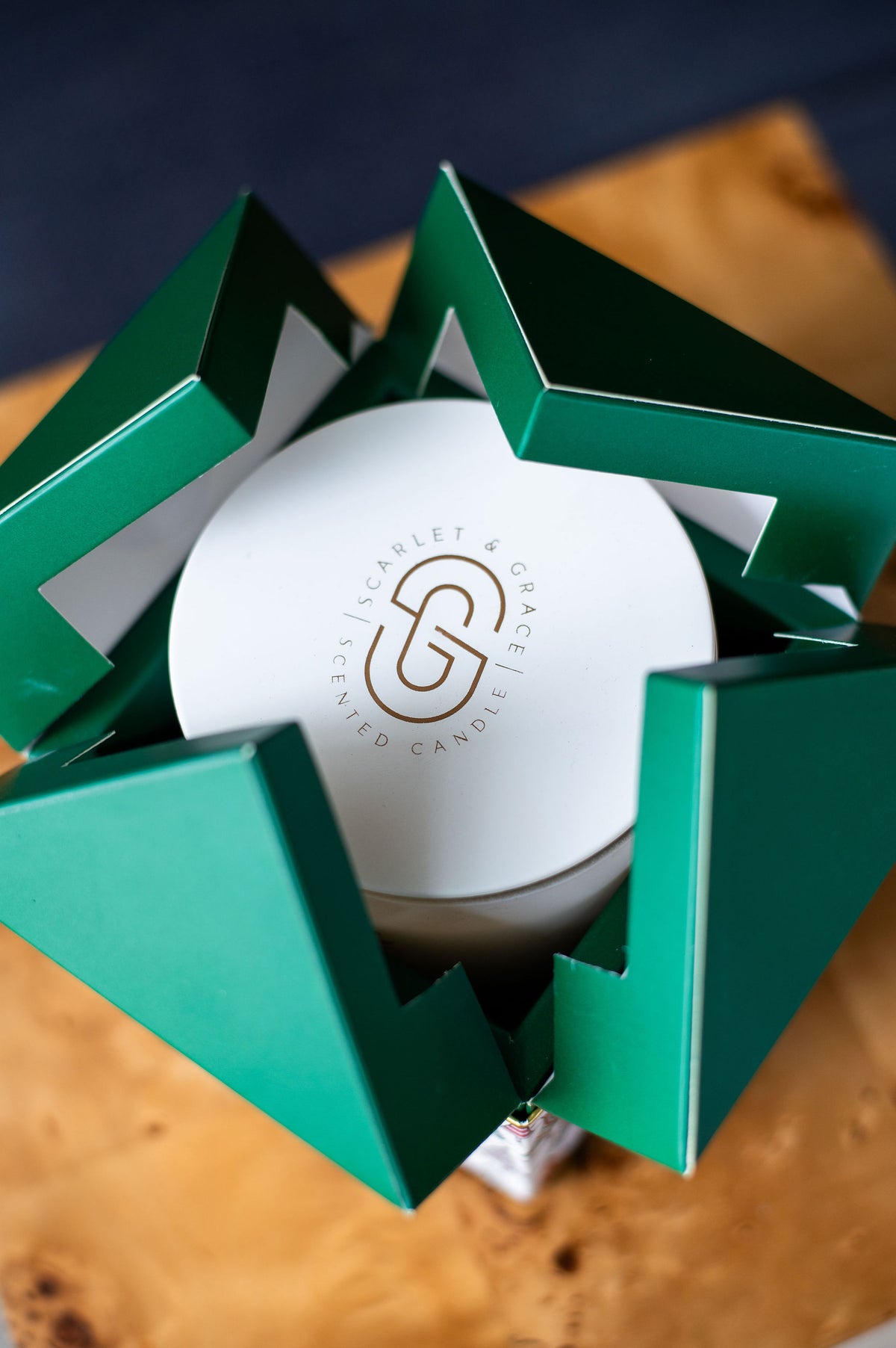 Christmas Tree Candle - Limited Edition (380g) in festive green packaging, displayed from an overhead view on a wooden surface.