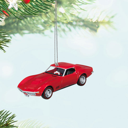 Classic American Cars 1968 Chevrolet® Corvette® L88 (Metal) Christmas ornament in vibrant red hanging from a tree branch.