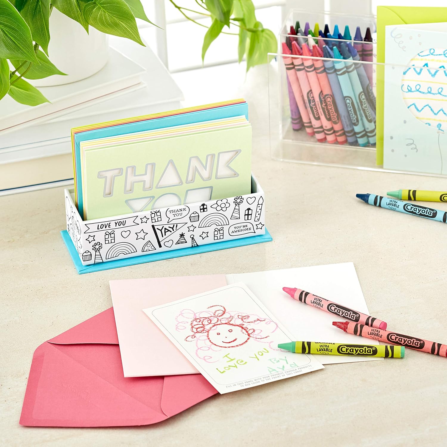 Hallmark Crayola Coloring Cards Assortment, 8 Cards with Envelopes and Markers in a card organiser with two crayons and pink envelopes.