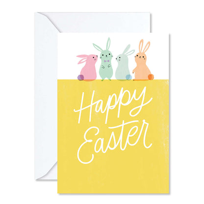 Greeting card with colorful bunnies and 'Happy Easter' text on a yellow background