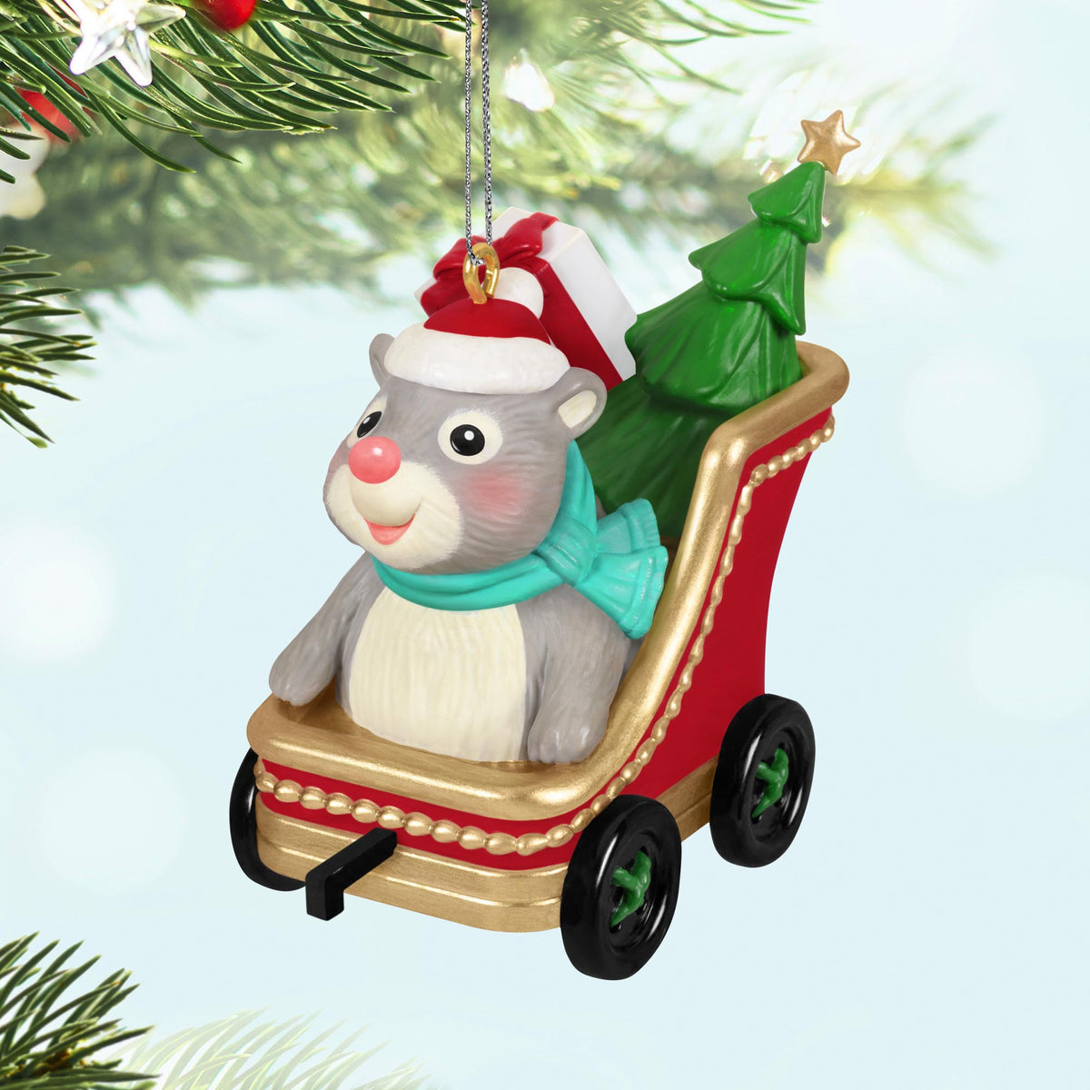 Cute As A Button — 2025 Hallmark Keepsake Christmas Ornament, grey hamster in red sleigh with tree, detailed view.