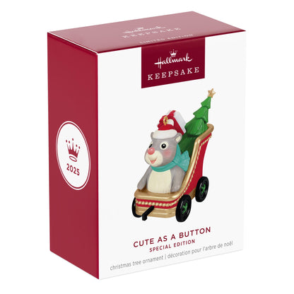 Cute As A Button — 2025 Hallmark Keepsake Christmas Ornament box featuring a grey and white hamster in a red sleigh with a Christmas tree.