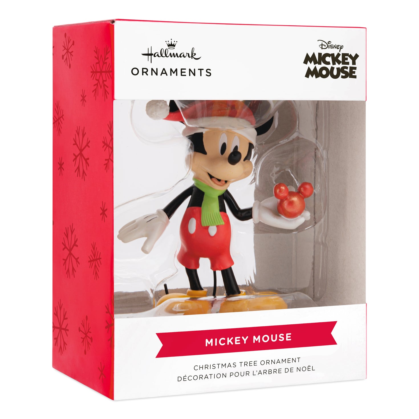 Hallmark Christmas ornament - Disney Mickey Mouse holding ornament in festive packaging with red accents and window display.