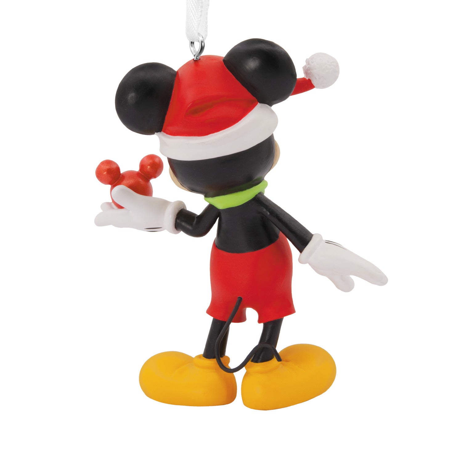 Hallmark Christmas ornament - Disney Mickey Mouse holding ornament in red and green, featuring a festive Santa hat and angled view.