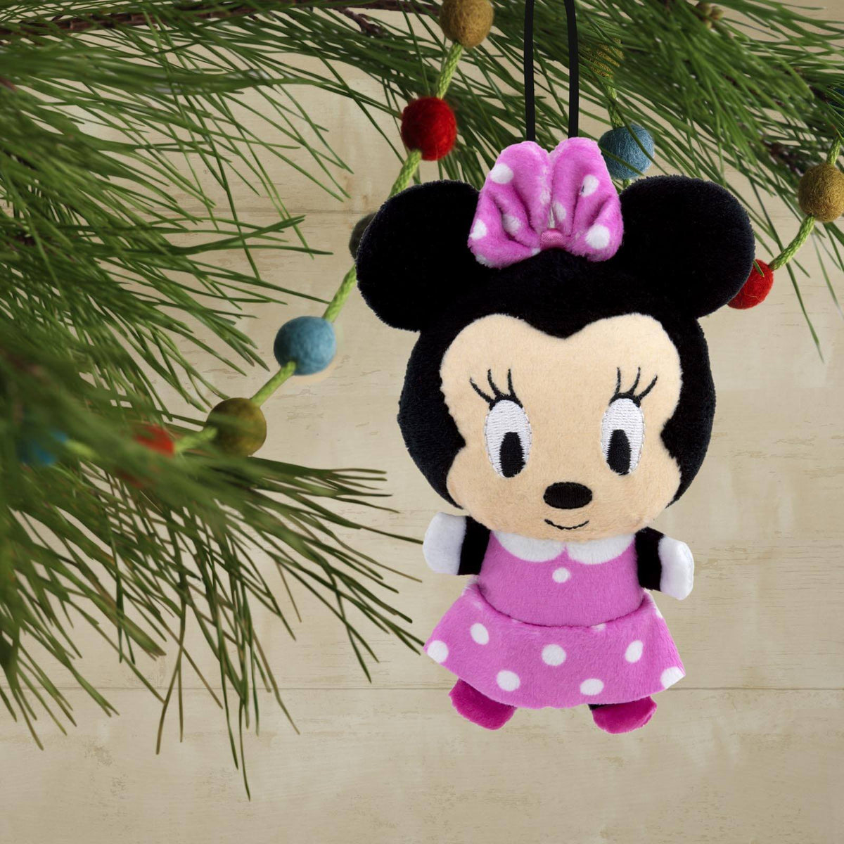 Disney Minnie Mouse, plush fabric - Hallmark Christmas ornament, soft, cut and sewn design, hanging on a Christmas tree.