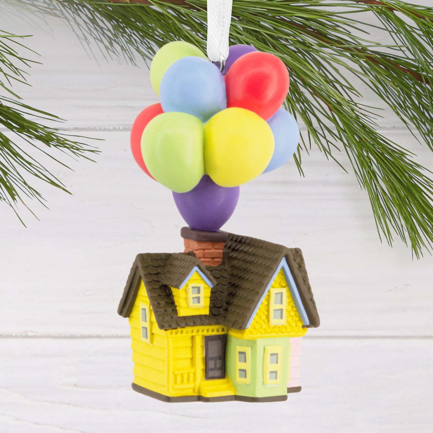 Disney/Pixar Up House - Hallmark Christmas Ornament, colourful miniature house with balloons, close up on white background.