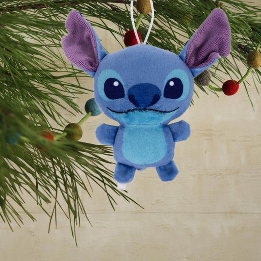 Disney Stitch, Plush Fabric - Hallmark Christmas Ornament hanging from a Christmas tree branch with colourful decorations.