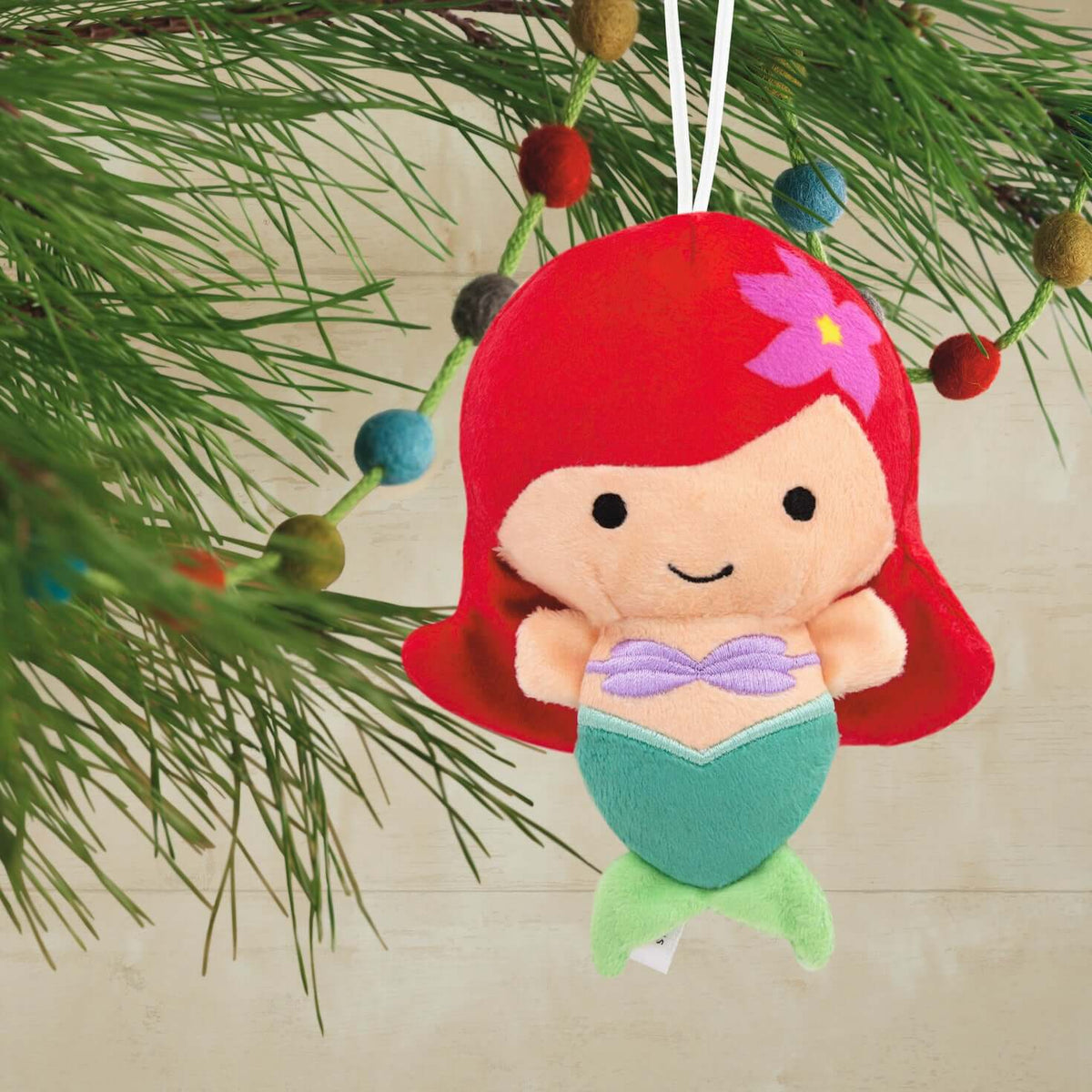 Disney The Little Mermaid Ariel, Plush Fabric - Hallmark Christmas Ornament, small plush decoration, hanging from a Christmas tree.