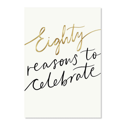 Hallmark 80th Birthday Card - Reasons To Celebrate featuring elegant gold foil lettering on a cream background, flat lay view.