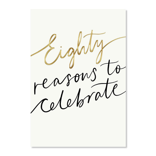 Hallmark 80th Birthday Card - Reasons To Celebrate featuring elegant gold foil lettering on a cream background, flat lay view.