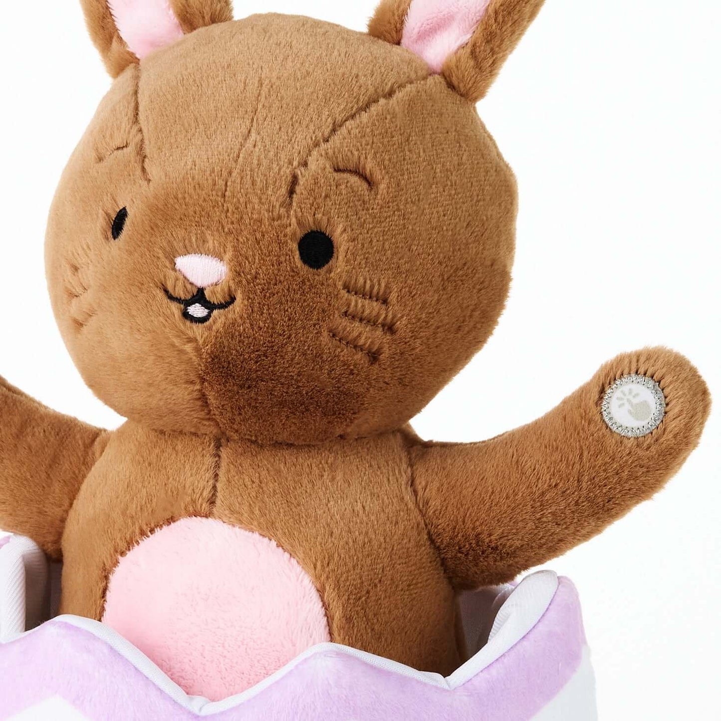 Excited for Eggs Bunny Plush With Sound and Motion, soft brown plush bunny with pink accents, close-up view of paws