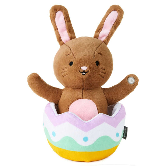 Excited for Eggs Bunny Plush With Sound and Motion, soft brown plush, sitting in a colourful Easter egg, cheerful pose.