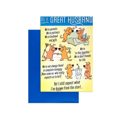 Fcc Husband Funny Dogs greeting card featuring humorous dog illustrations and a blue envelope, flat lay view.
