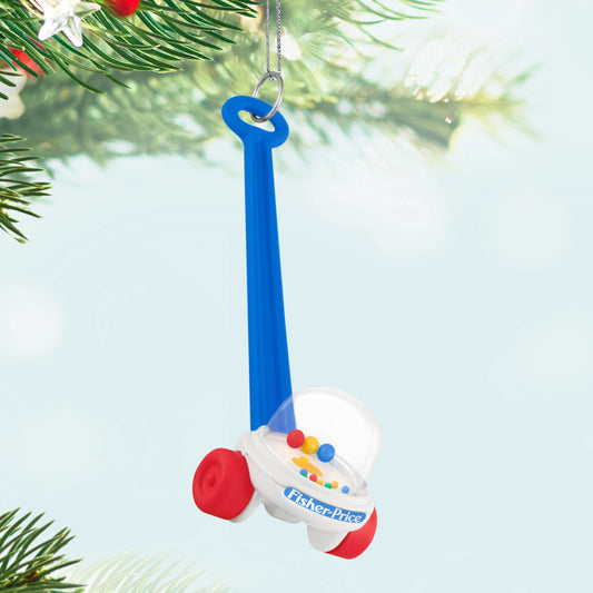 Fisher-Price™ Corn Popper™ — 2025 Hallmark Keepsake Christmas Ornament, colourful design, hanging from a tree branch.