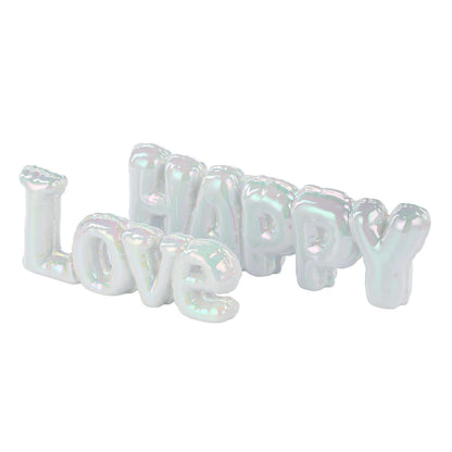 Happy Balloon Sculpture 34x5x11cm, clay decorative item, iridescent glaze, angled view showcasing lettering