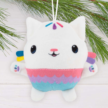 Gabby's Dollhouse Cakey Cat, Fabric - Hallmark Christmas Ornament, soft plush in pink and blue with a cheerful expression, hanging from a pine branch.