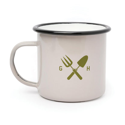 Garden enamel mug 500ml in cream with black rim, featuring gardening tool illustrations, angled view.
