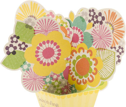 Hallmark Get Well Greeting Card (Pop-Up Flowers) featuring a vibrant flower pop-up design with bright colours and patterns.