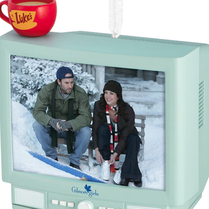 Gilmore Girls With Light and Sound — 2026 Hallmark Keepsake Christmas Ornament featuring Luke and Lorelai on a vintage TV set against a winter backdrop.