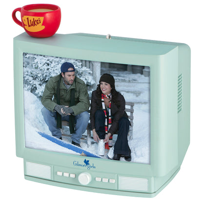 Gilmore Girls With Light and Sound — 2026 Hallmark Keepsake Christmas Ornament featuring Luke's Diner mug on retro TV design with characters.