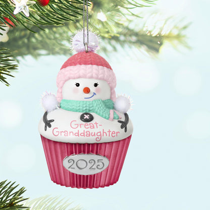 Great-Granddaughter — 2025 Hallmark Keepsake Christmas Ornament, snow-girl cupcake design, hanging from a Christmas tree branch, festive details.