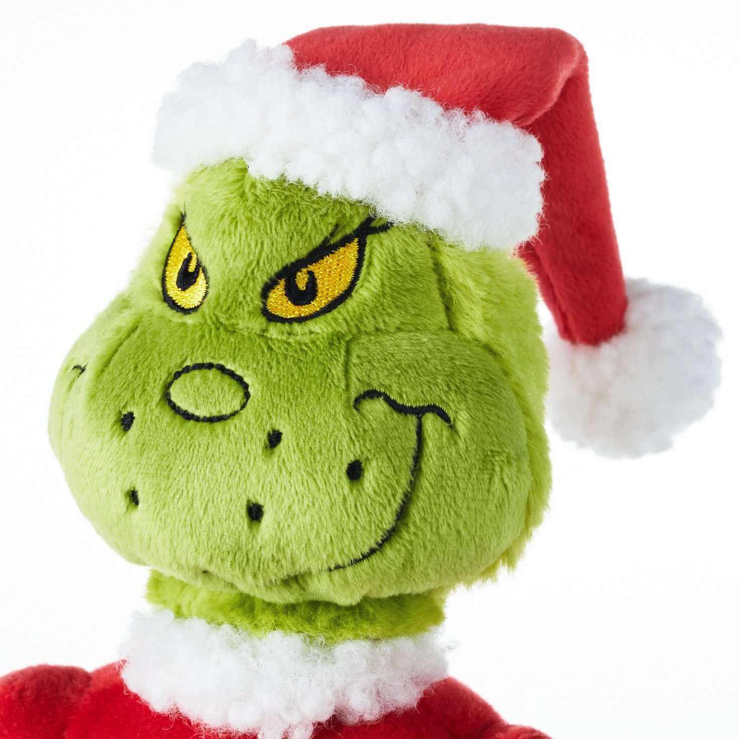 Dr. Seuss's How the Grinch Stole Christmas!™ Grinch on sled musical plush with motion, detailed plush face, wearing Santa hat.