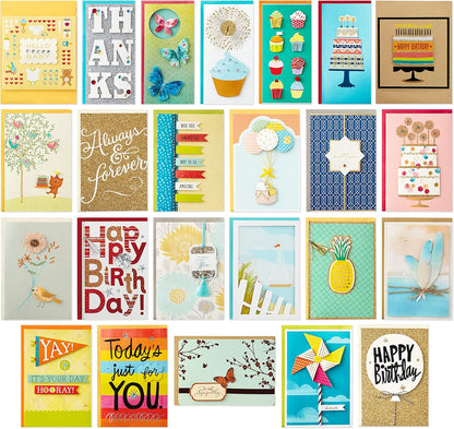 Hallmark All Occasion Handmade Boxed Set of Assorted Greeting Cards with Card Organizer (Pack of 24) featuring vibrant designs and embellishments in a flat lay arrangement.