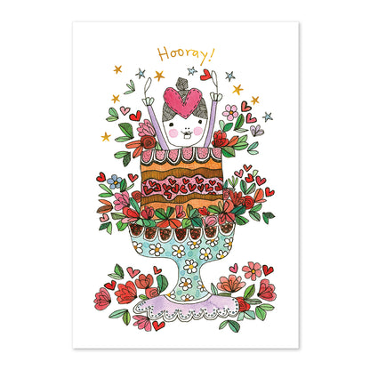 Hallmark x Love, Meredith Birthday Greeting Card - Hooray! featuring a girl jumping out of a decorated cake surrounded by flowers and stars.