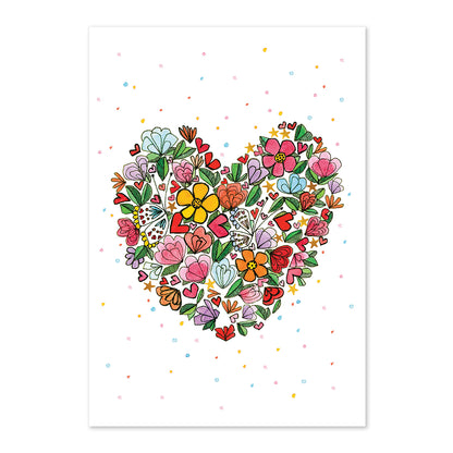 Heart-shaped arrangement of colorful flowers on a white background