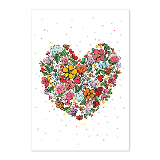 Heart-shaped arrangement of colorful flowers on a white background