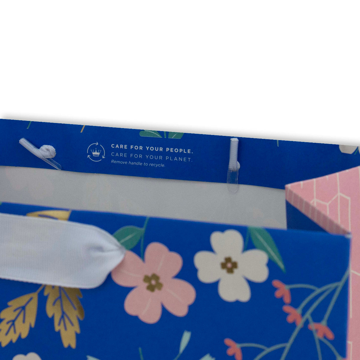 Hallmark Large Gift Bag - Sky Blue Floral featuring white ribbon handle and recycling instructions on the interior flap.