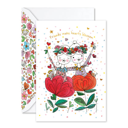 Greeting card with two people holding hearts and flowers, surrounded by colorful text and patterns.