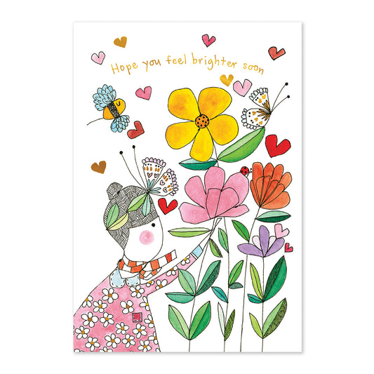 Illustration of a person with flowers and butterflies on a white background