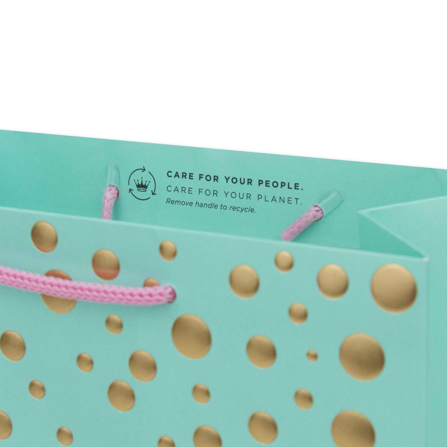 Hallmark Medium Gift Bag - Gold Bubbles, aqua gift bag with gold dots and pink cord handles, featuring recycling care instructions on the inside.