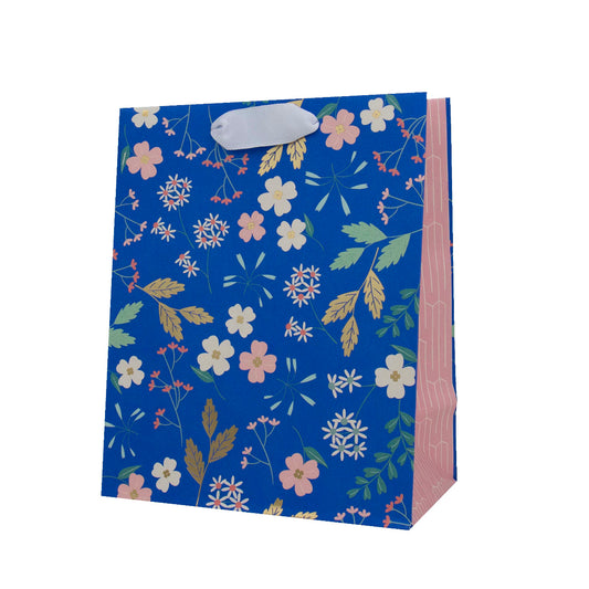 Hallmark Medium Gift Bag - Sky Blue Floral in a floral design with gold foil elements, featuring a white ribbon handle. Side view.