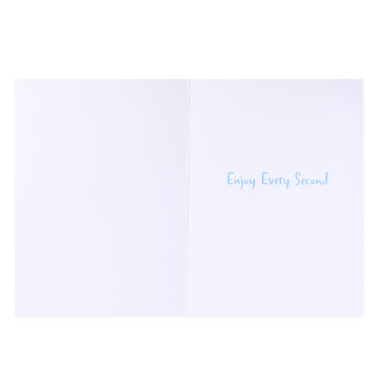 Hallmark Colossal New Baby Congratulations Greeting Card - Rainbow & Spots, inside view with blue text saying 'Enjoy Every Second' on white background.