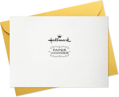 Hallmark Paper Wonder Pop Up Baby Shower Card (Sweet Dream Come True) on yellow envelope, showing logo detail and clean design.