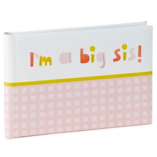 Hallmark Photo Book - Big Sister in pink gingham design, featuring the phrase 'I'm a big sis!' on the cover, angled view.