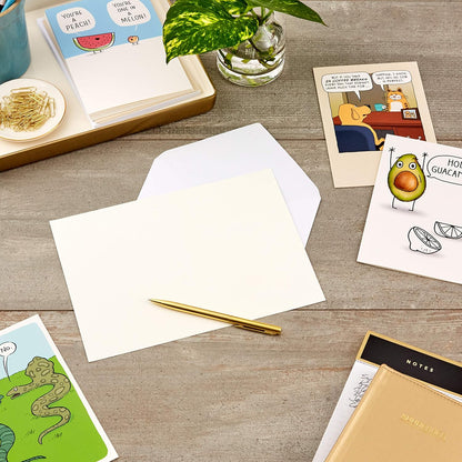 Hallmark Shoebox Funny Blank Cards Assortment (12 All Occasion Cards with Envelopes) arranged on a table with a gold pen, showcasing blank card design and envelopes.