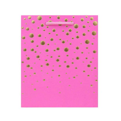 Hallmark Small Gift Bag - Gold Bubbles in bright pink with gold embossed dots and pink cord handles, flat lay view.