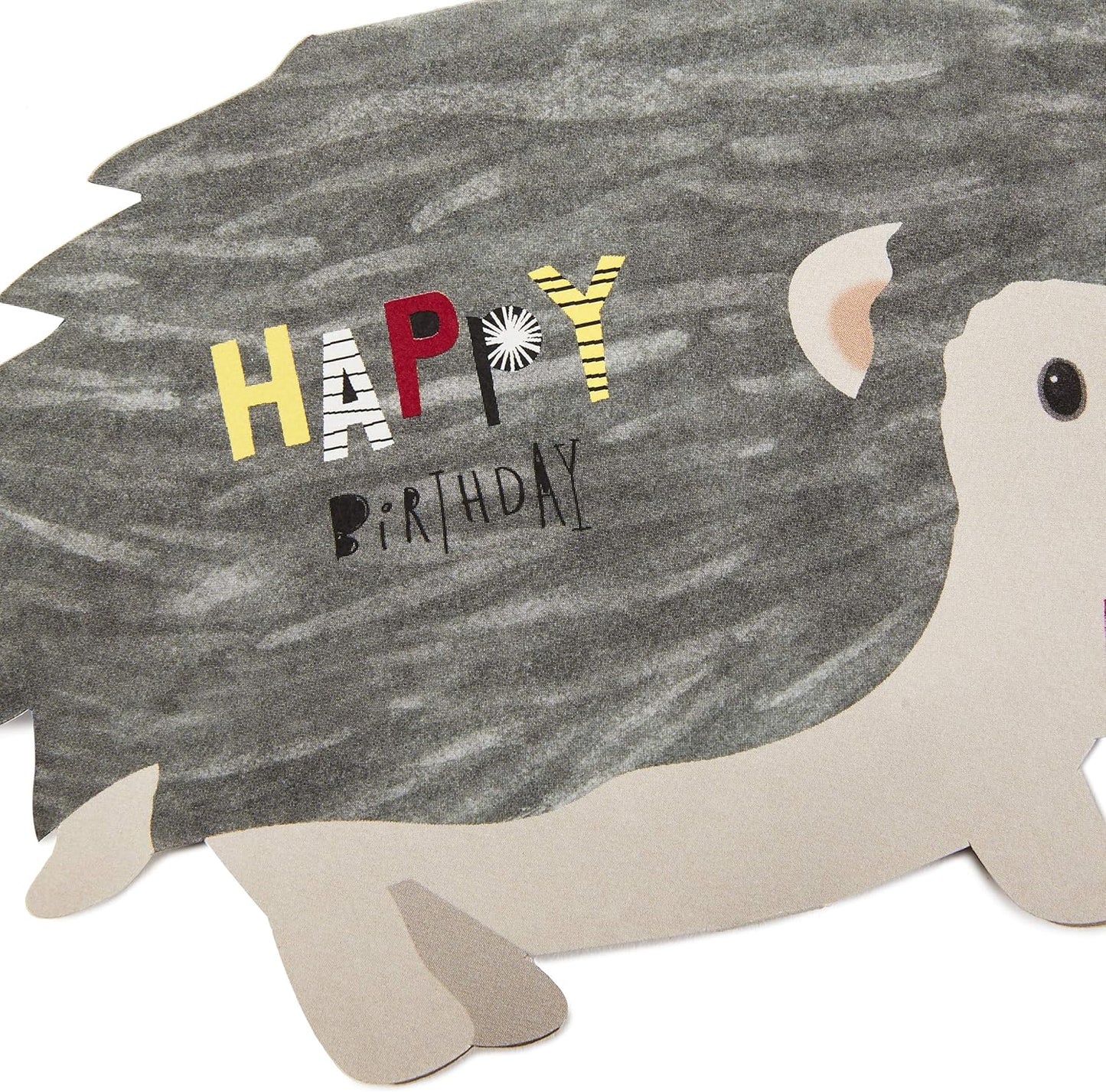 Hallmark Pop Up Birthday Card (3D Honeycomb Hedgehog) featuring a cheerful hedgehog with a dark spiky back and colourful 'Happy Birthday' lettering.