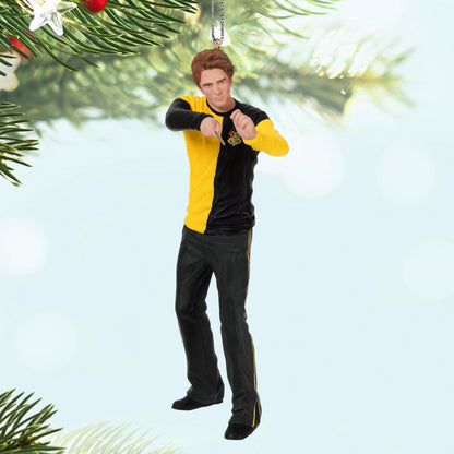 Harry Potter™ Cedric Diggory — 2025 Hallmark Keepsake Christmas Ornament, 3D figurine in Hufflepuff colours, hanging from a Christmas tree.