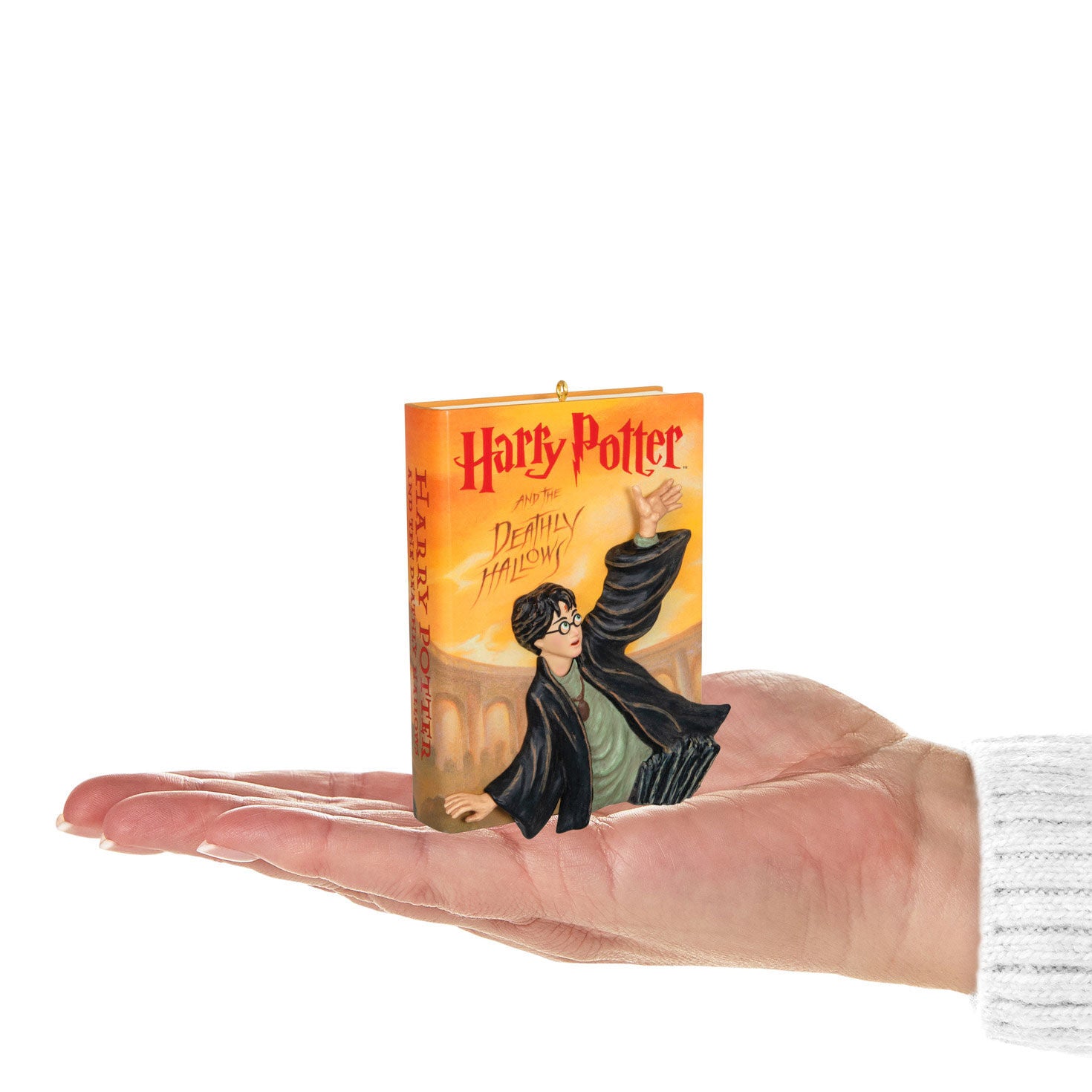 Harry Potter and the Deathly Hallows™ — Hallmark Keepsake Christmas Ornament held in hand, featuring detailed artwork of Harry Potter.