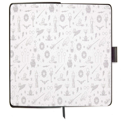 Harry Potter™ Faux Leather Journal, 6.18x8.25 with grey patterned interior featuring iconic Wizarding World symbols in a flat lay view.