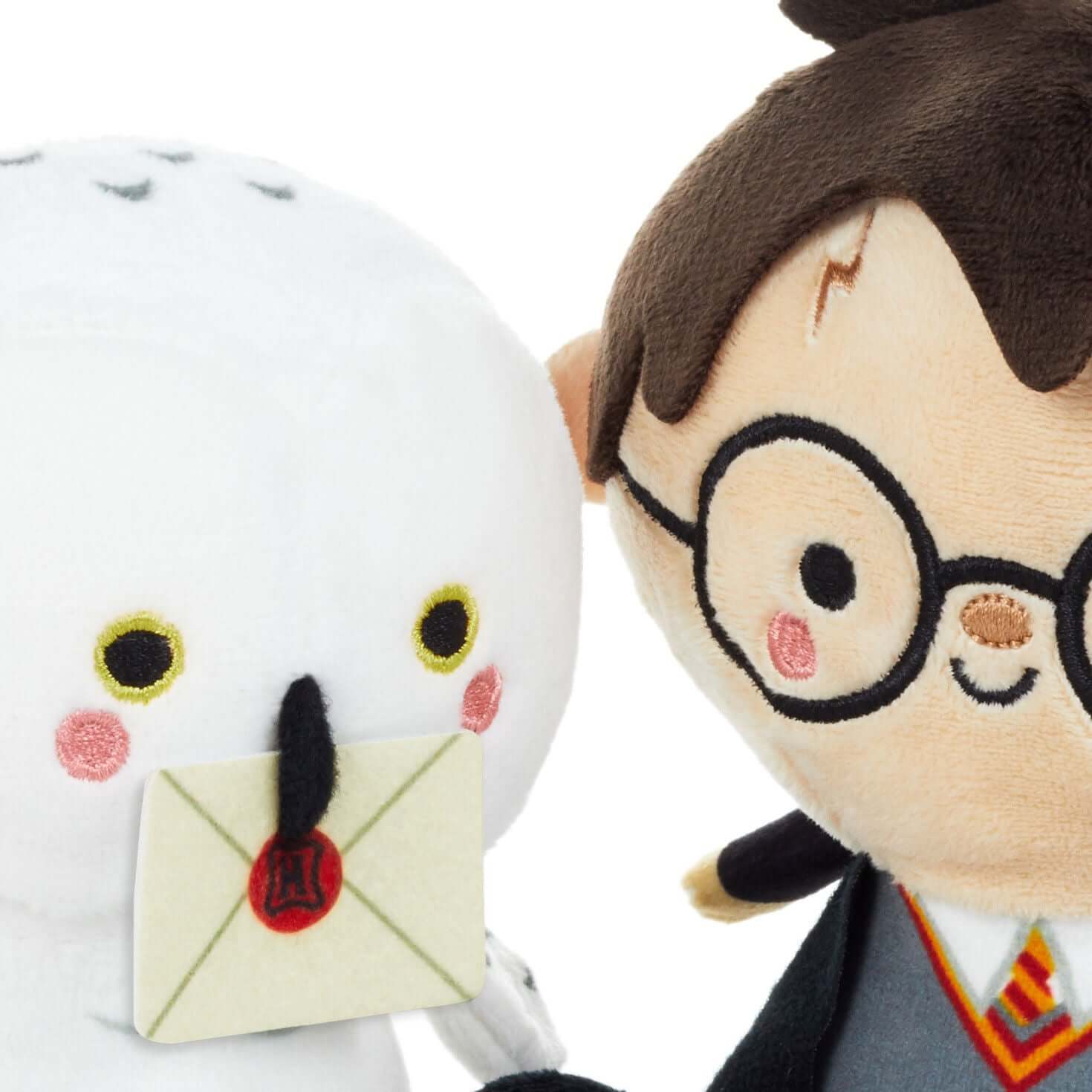 Better Together Harry Potter™ and Hedwig™ Magnetic Plush Pair, 5.5". Close up of Harry in Hogwarts robe with Hedwig holding a letter.