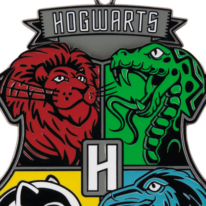 Harry Potter™ Hogwarts™ Crest Moving Metal Hallmark Ornament featuring Gryffindor, Slytherin, Hufflepuff, and Ravenclaw house symbols.