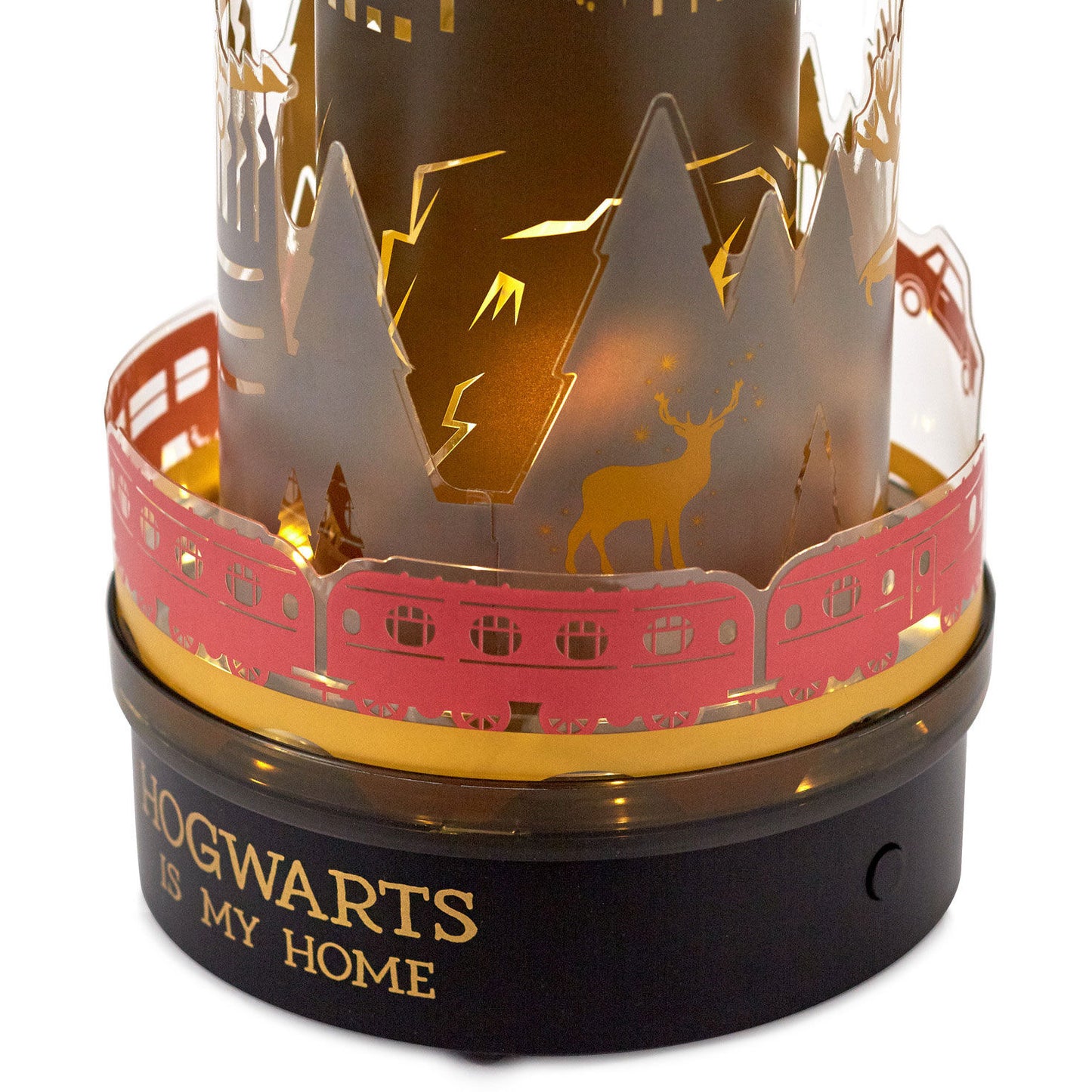 Harry Potter™ Hogwarts rotating lamp with sound, angled view showcasing intricate cutouts and light-up details, decorative base.