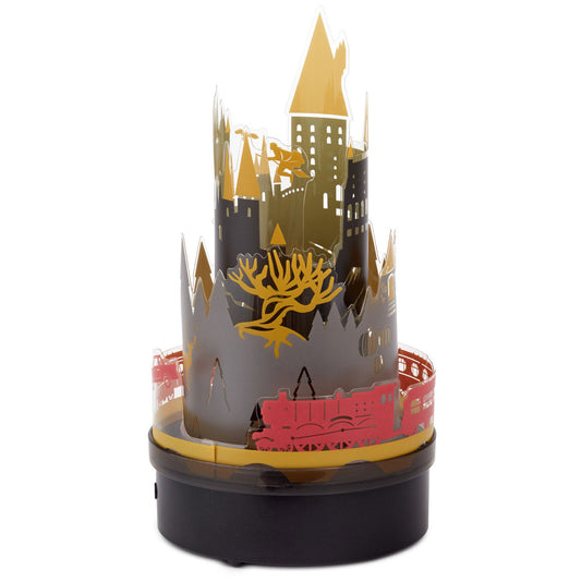 Harry Potter™ Hogwarts rotating lamp with sound featuring detailed Hogwarts silhouette and Hogwarts Express design in a compact size.