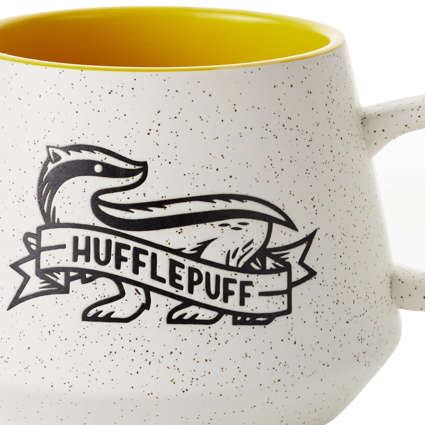 Harry Potter™ Retro Hufflepuff™ Mug, 770ml in ceramic with yellow interior and Hufflepuff badger design, angled view.